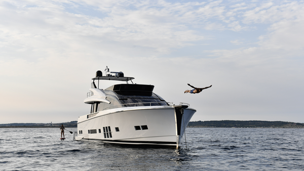 Man jumping into ocean off a yacht