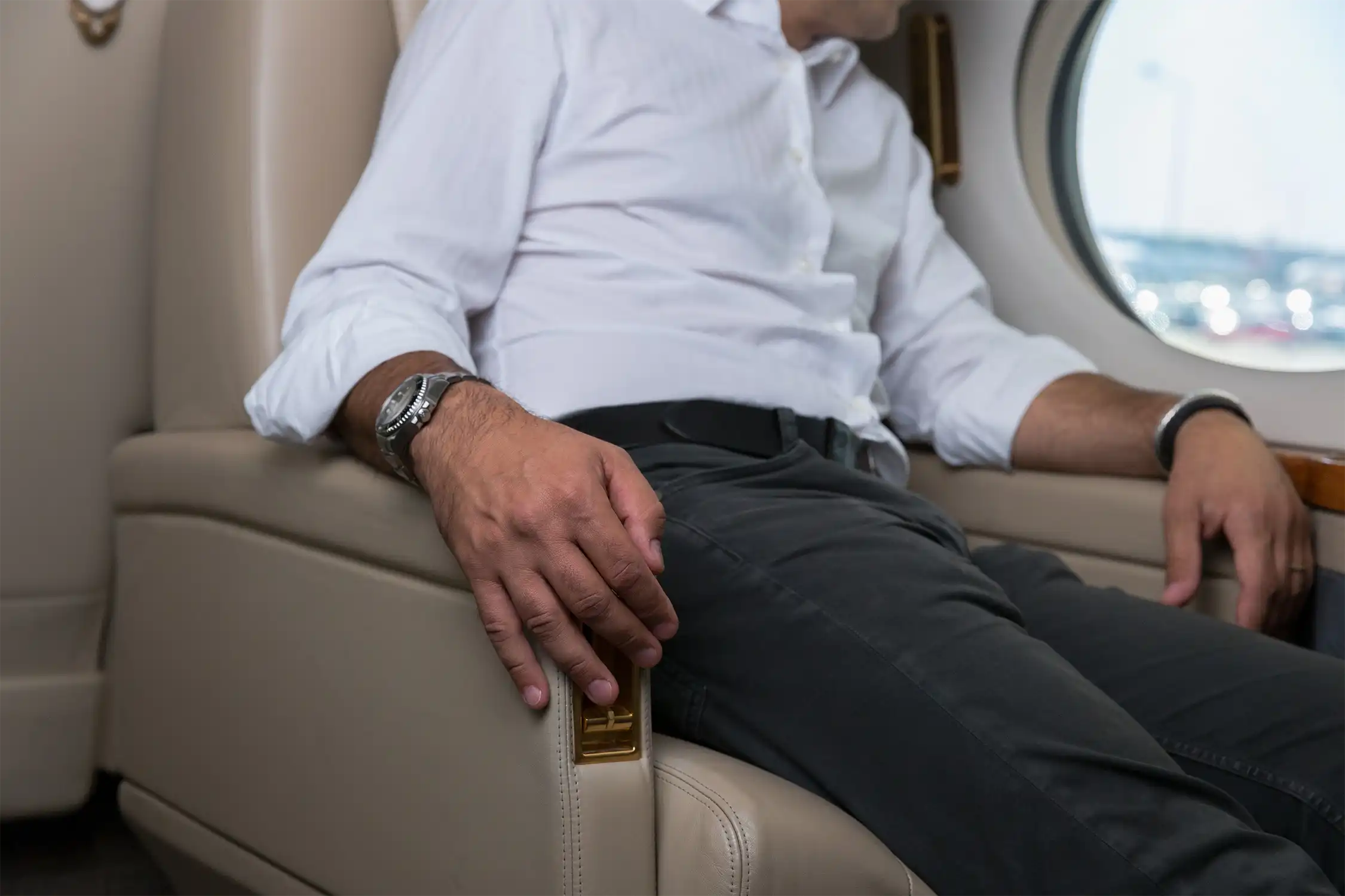 Businessman sitting in a business jet