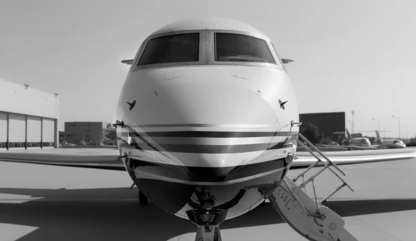 The nose of a Gulfstream business jet from the front.